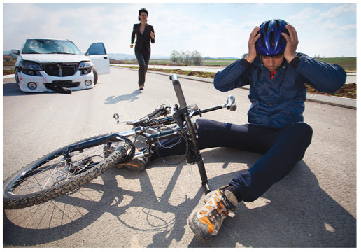 bicyclist hit by car on road