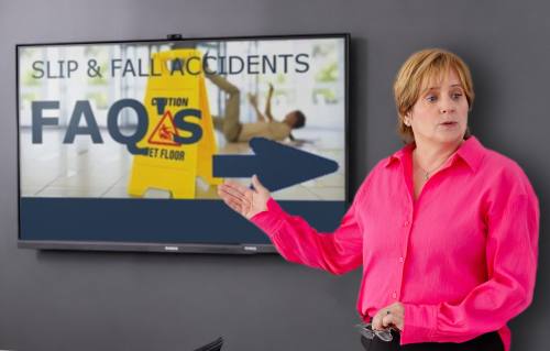 Attorney vivian standing next to sign with text that reads "slip and fall accidents f.a.q."